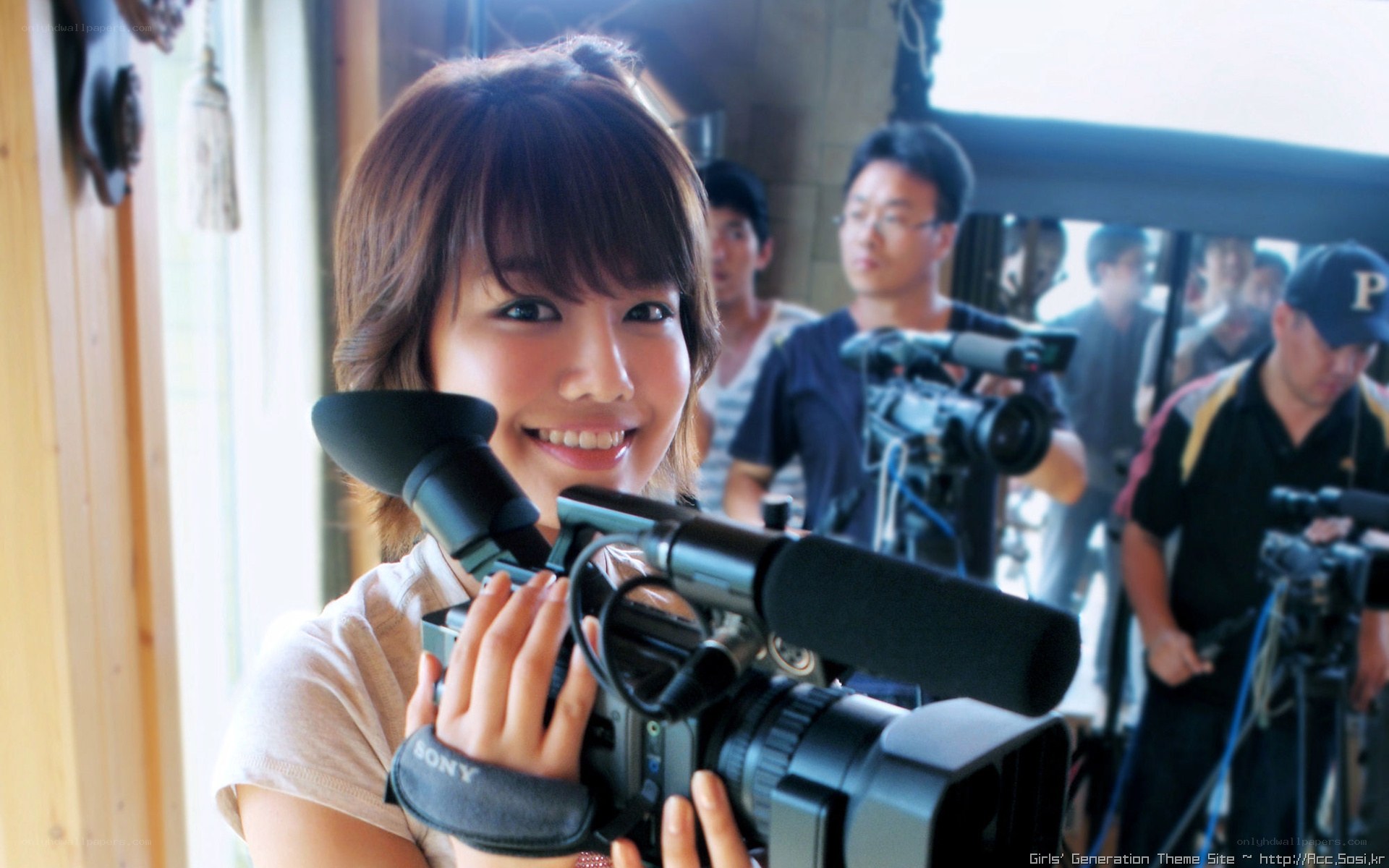 woman holding video camera
