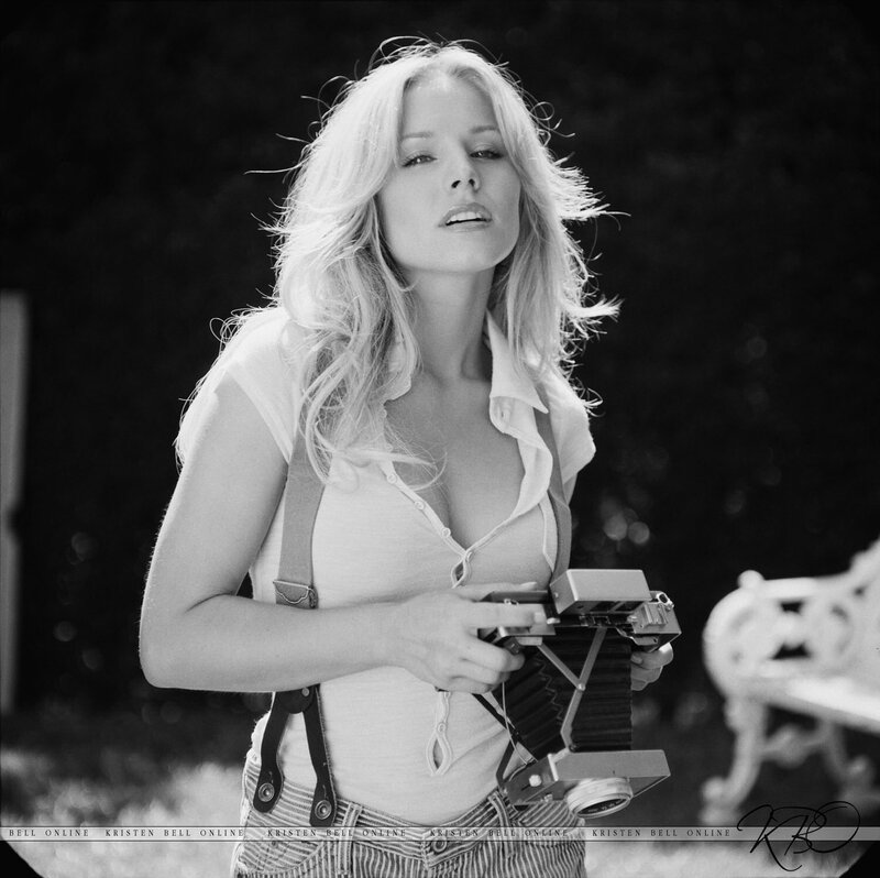 woman holding vintage camera