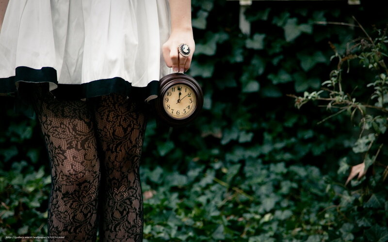 woman holding vintage clock