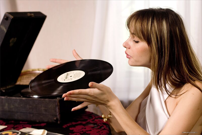 woman holding vinyl record