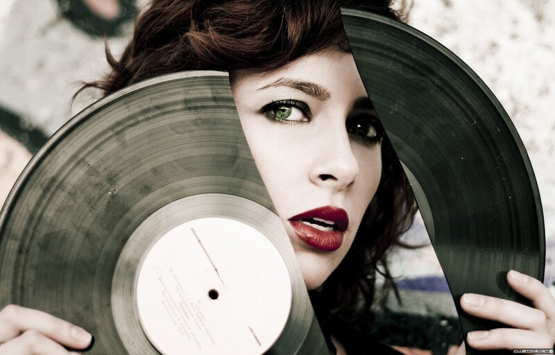 woman holding vinyl record
