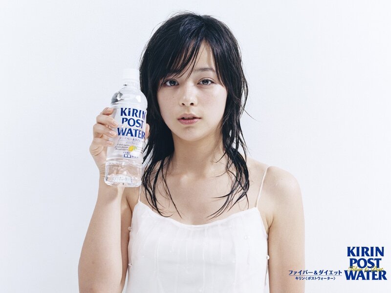 woman holding water bottle