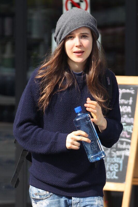 woman holding water bottle
