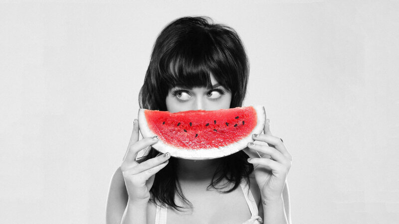 woman holding watermelon slice