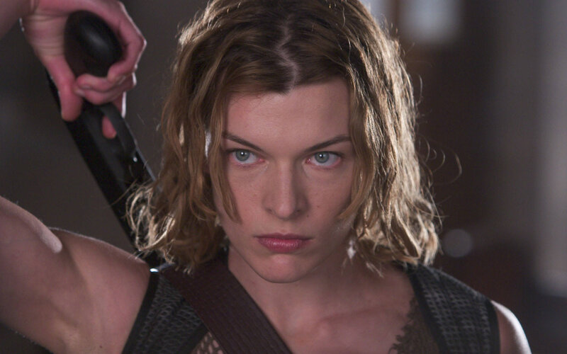 woman holding weapon in action scene