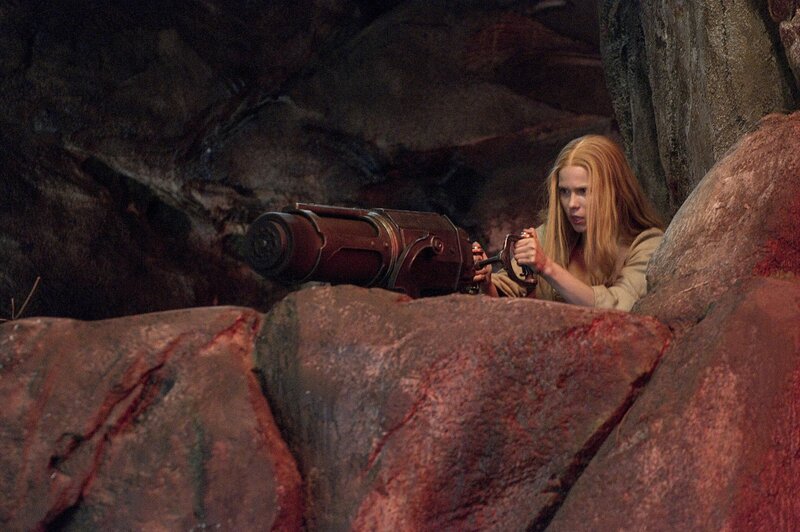 Woman Holding Weapon — Red, Tense
