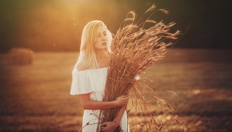 Woman Holding Wheat — Gold