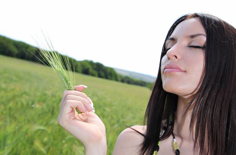 woman holding wheat in field