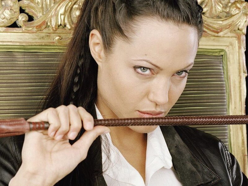 Woman Holding Whip — Brown, Intense