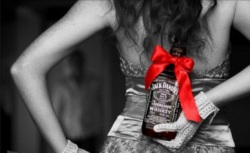 Woman Holding Whiskey Bottle — Black