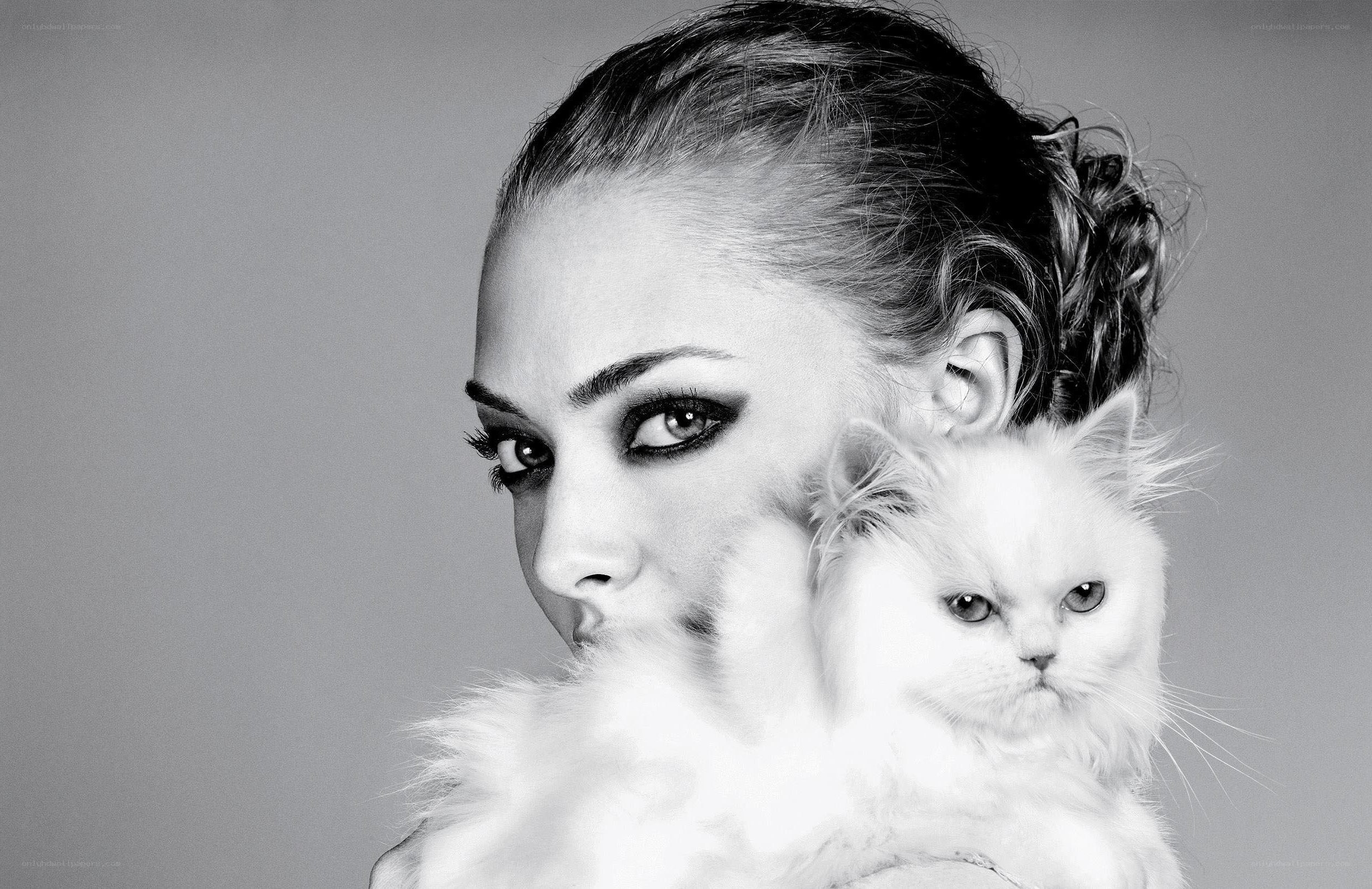 woman holding white cat