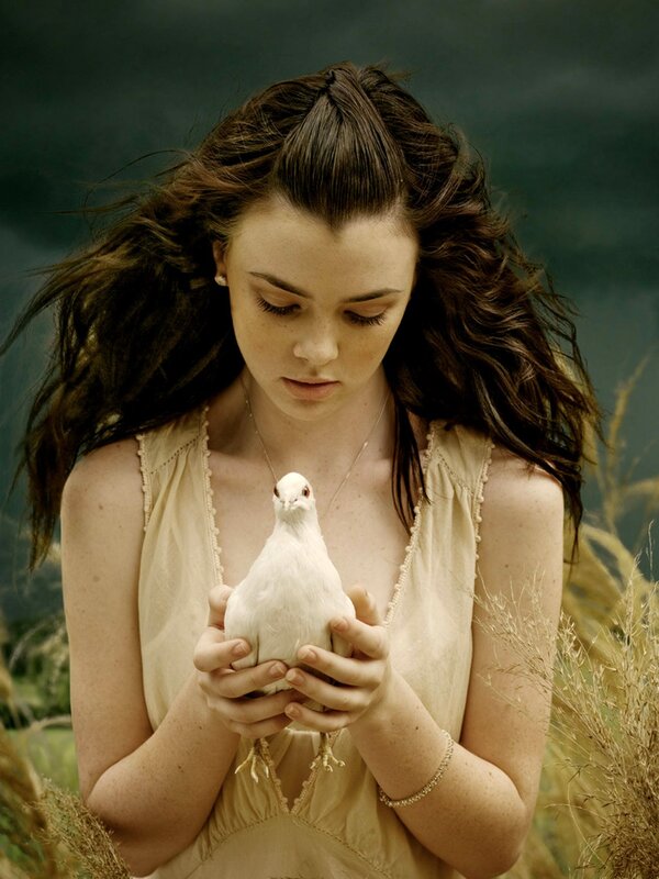 woman holding white dove