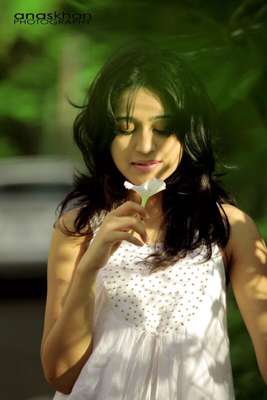 woman holding white flower