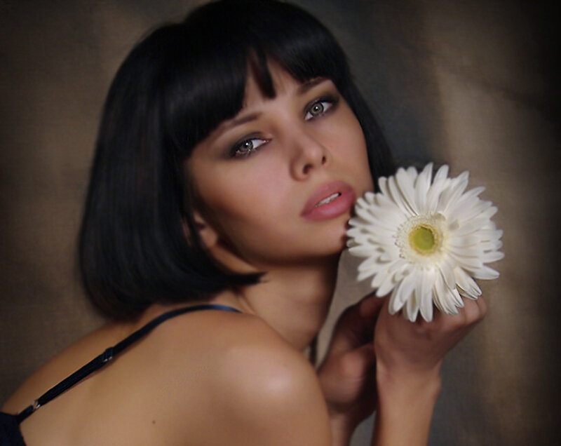 Woman Holding White Flower — Dramatic