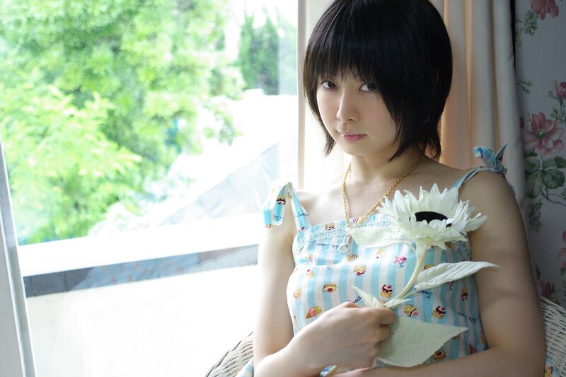 woman holding white flower