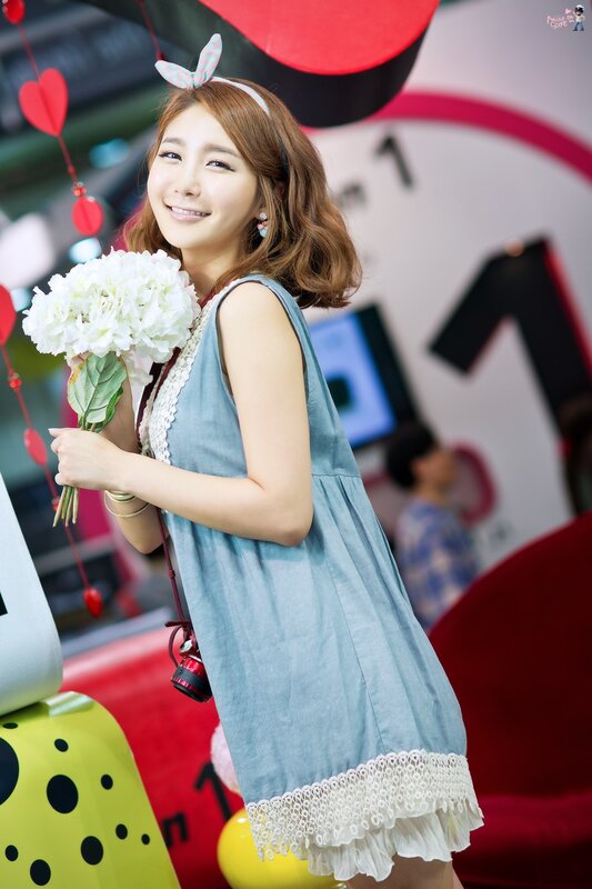 woman holding white flowers