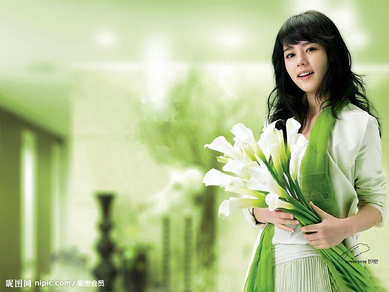 woman holding white flowers