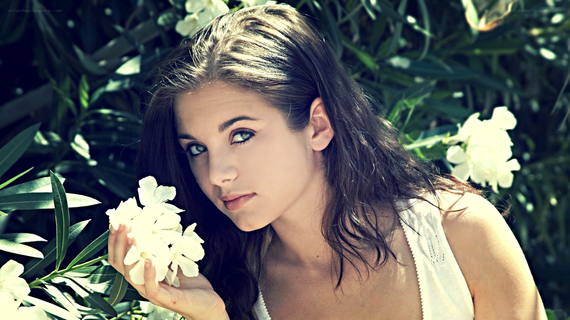 woman holding white flowers
