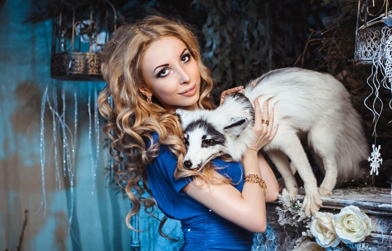 Woman Holding White Fox — Blue, Dramatic
