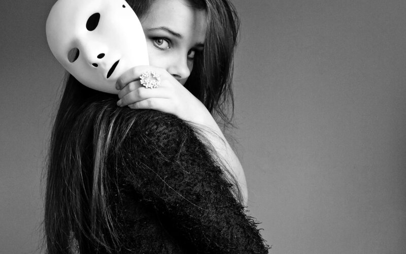woman holding white mask