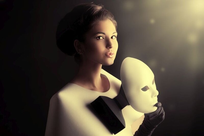 Woman Holding White Mask — Dramatic