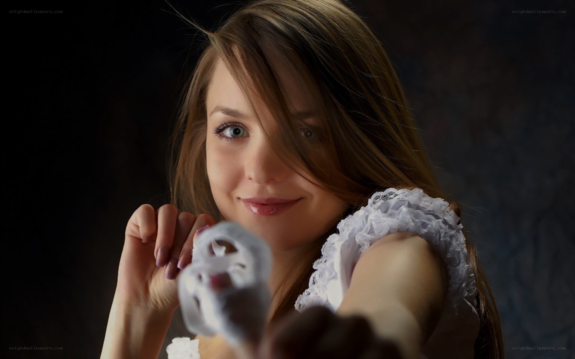 woman holding white object