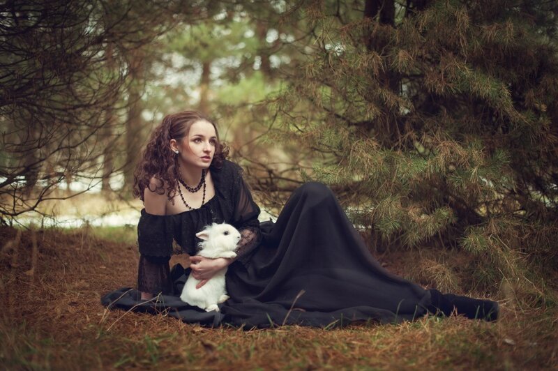 Woman Holding White Rabbit — Black, Serene