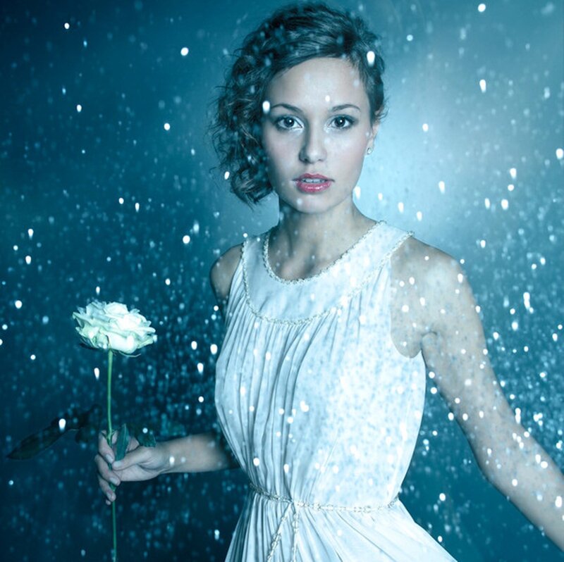 Woman Holding White Rose — Blue, Dramatic
