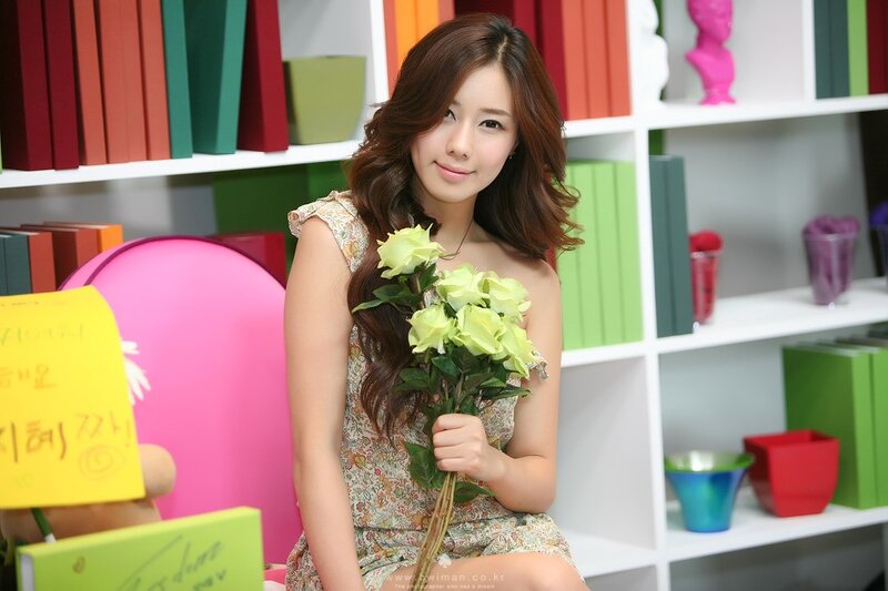 Woman holding white roses