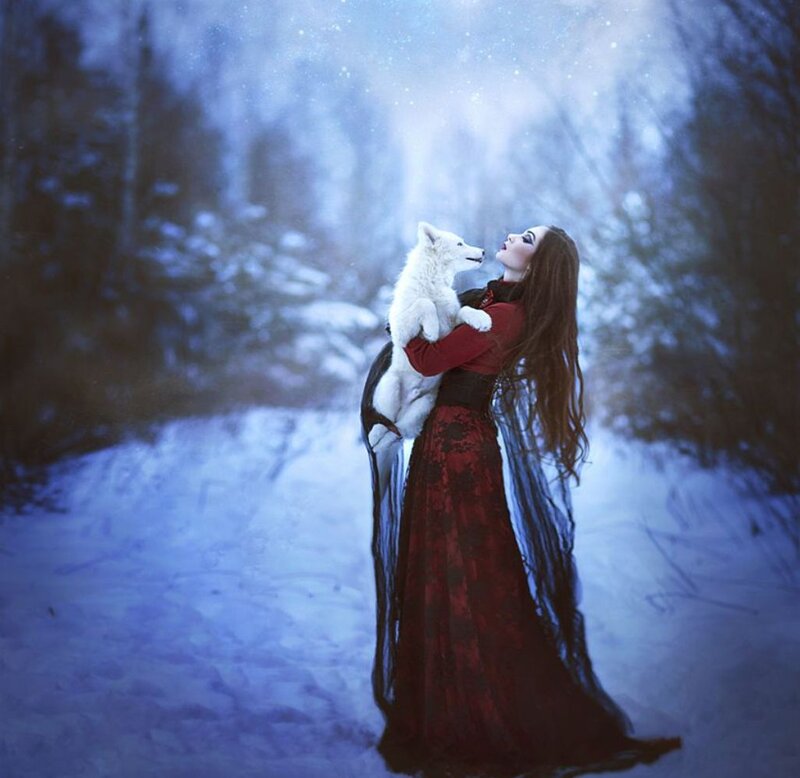 Woman Holding White Wolf