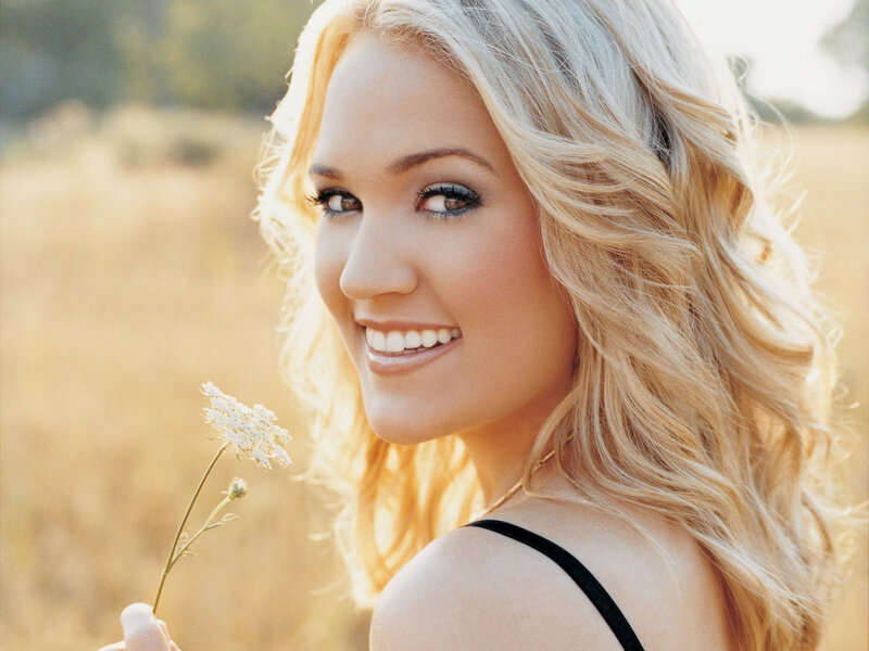 woman holding wildflower