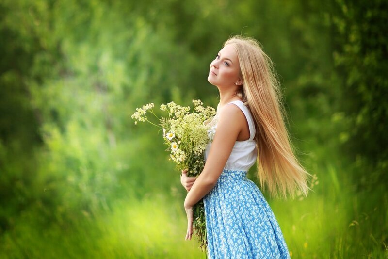 Woman Holding Wildflowers — Blue
