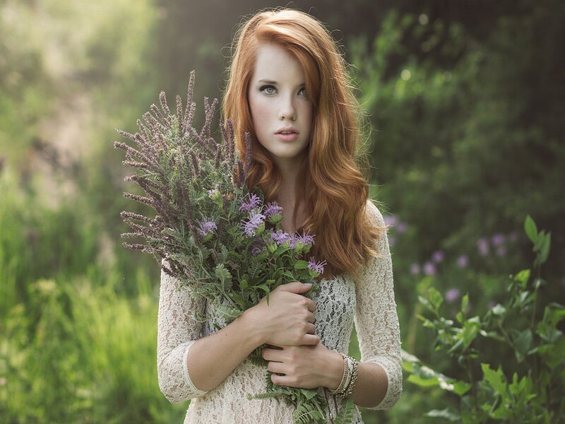 Woman Holding Wildflowers — Red