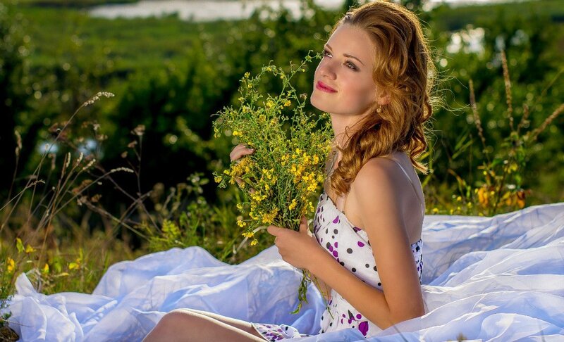 Woman Holding Wildflowers — White, Serene