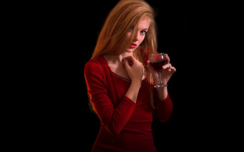 woman holding wine glass
