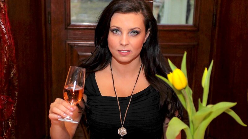 woman holding wine glass
