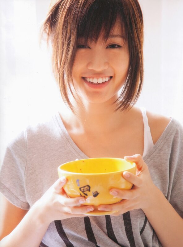 Woman holding yellow bowl
