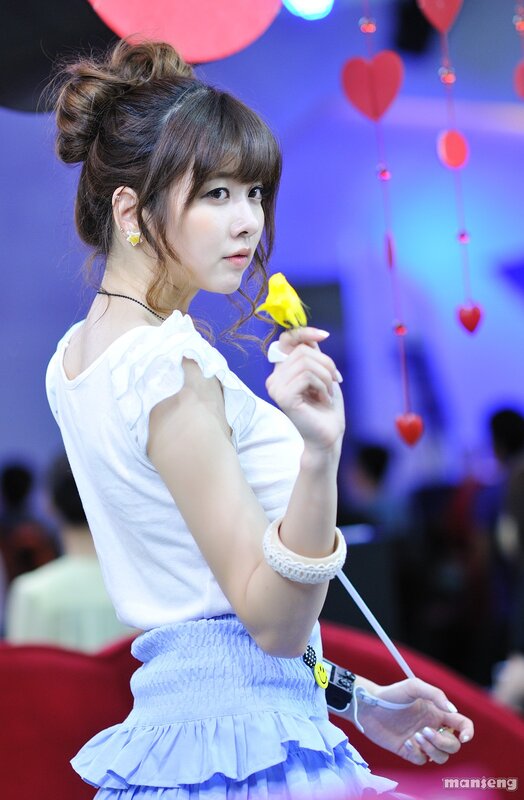 Woman holding yellow flower