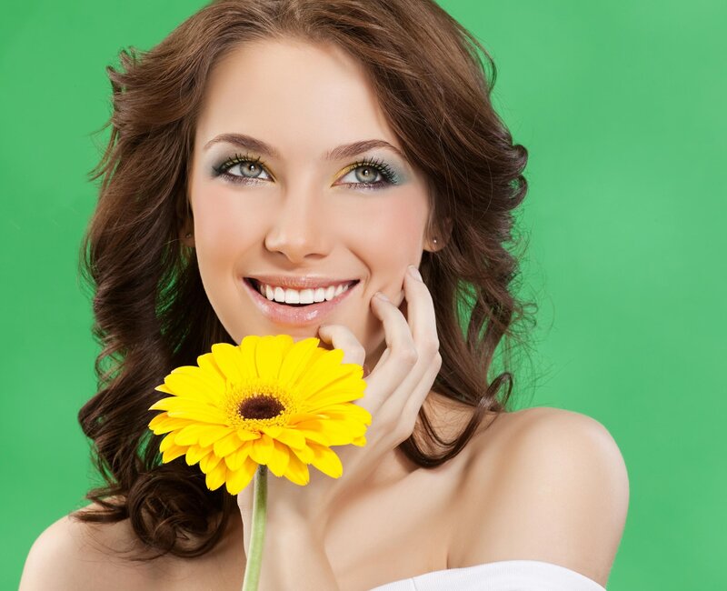 Woman Holding Yellow Flower — Green