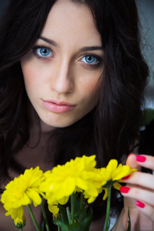 Woman Holding Yellow Flowers — Calm, Photograph