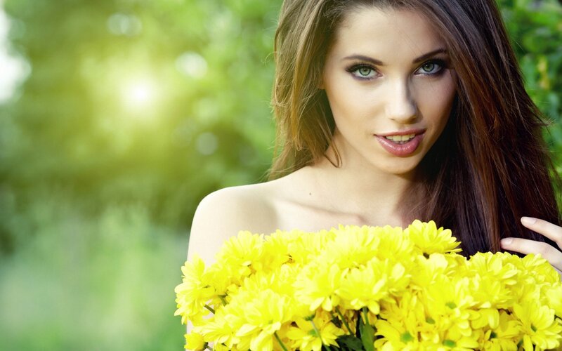 Woman Holding Yellow Flowers — Serene, Afternoon, Photograph, Greenery