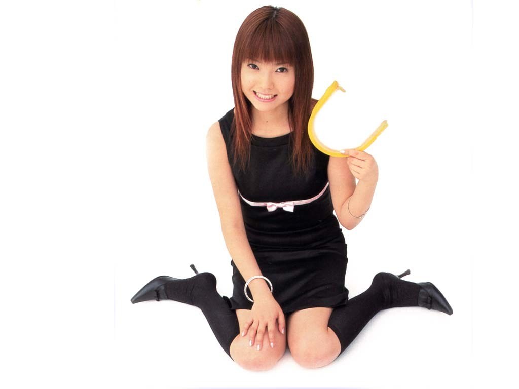 woman holding yellow object