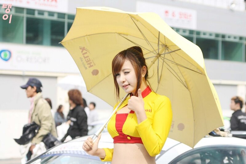 Woman holding yellow umbrella at event