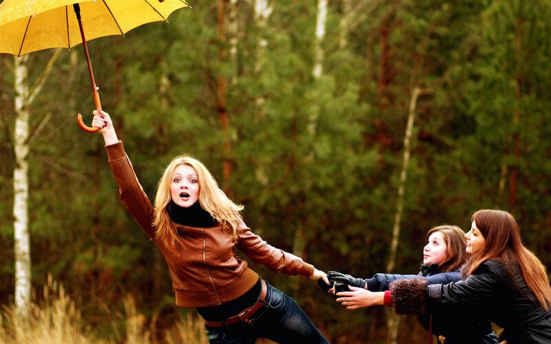 Woman Holding Yellow Umbrella — Dramatic