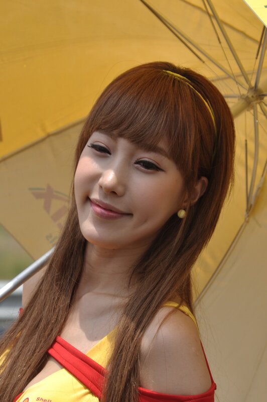 woman holding yellow umbrella