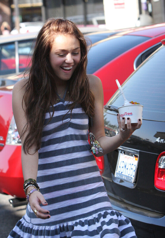 Woman holding yogurt cup