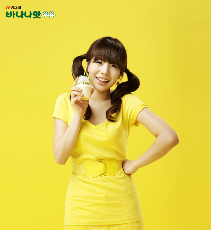woman holding yogurt drink