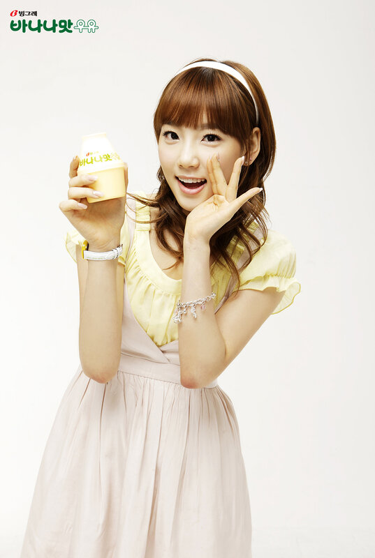 woman holding yogurt drink