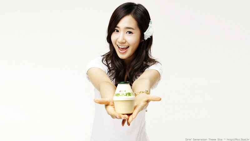 woman holding yogurt