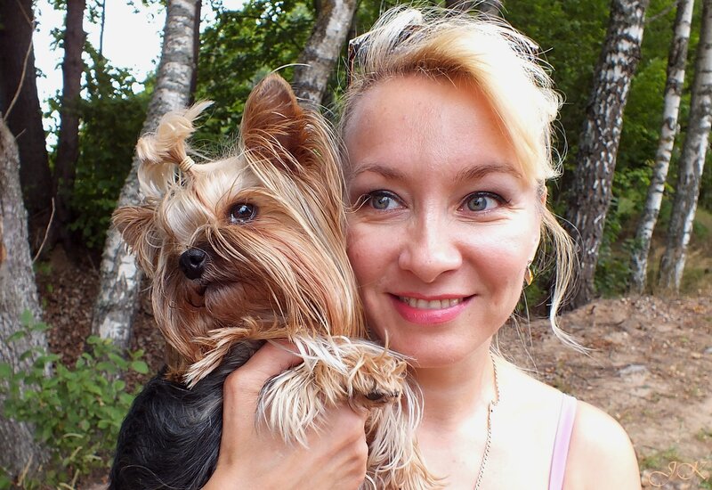 Woman Holding Yorkshire Terrier